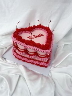 a heart shaped cake with two hearts on it