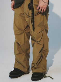 Editor's NoteCord.'s crease nylon banding pants are the new summer version of one of the brand's steady seller item. With a light and crispy nylon fabric, you can easily wear it during the summer season. It has a distinctive design point of crease details on both front and back, and has a color blocking detail near the hem of the back. With elastic waistband and string, it has a comfortable wear that fits various body types, and has an adjustable silhouette with strings and stoppers on the hem. Style it with various items for a young streetwear outfit. - Crease detail on front and back- Elastic waistband with string- Color block detail on the back- Adjustable hem with string and stopperMeasurements (in.)M/LWaist: 14.17 in / 14.57 inCrotch: 14.57 in / 14.96 inThigh: 14.17 in / 14.57 in Stretch Nylon Parachute Pants For Outdoor, Nylon Techwear Trousers, Nylon Techwear Pants, Techwear Nylon Trousers, Urban Parachute Pants With Elastic Waistband For Summer, Urban Style Summer Parachute Pants With Elastic Waistband, Urban Nylon Bottoms For Summer, Urban Nylon Parachute Pants For Outdoor, Nylon Techwear Bottoms With Elastic Waistband