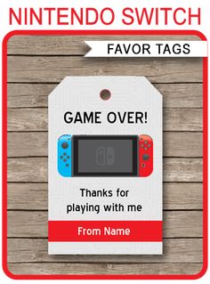 a nintendo switch game over tag hanging from a wooden wall with text saying,'favor tags thanks for playing with me from name