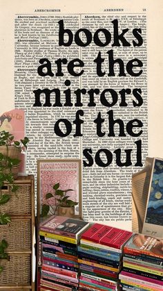 books are the mirrors of the soul on display in front of a wall with words