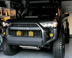 the front end of a black toyota truck