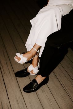 a bride and groom's feet in wedding shoes on the floor at their wedding