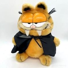 a stuffed animal that is wearing a costume