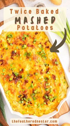 a casserole dish with bacon, cheese and green onions