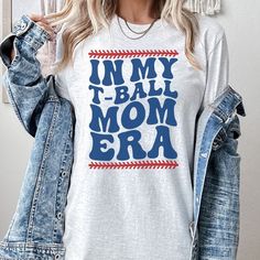 a woman wearing a t - shirt with the words in my ball mom era on it