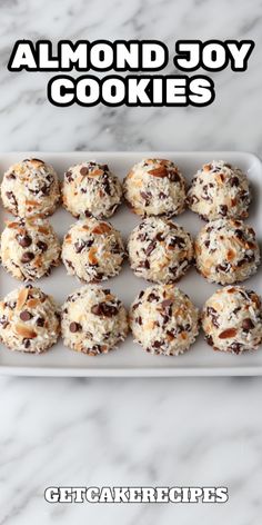 almond joy cookies on a tray with the words, get cakerecipes above it