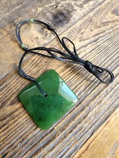 Canadian Jade Square Jade Pendant. Measures approximately 30mm on an adjustable wax cord Comes with or without our handcrafted wooden gift box Artisan Jewelry With Adjustable Length As Gift, Artisan Jewelry With Adjustable Length For Gift, Handmade Adjustable Rectangular Necklace, Adjustable Rectangular Jewelry Gift, Adjustable Rectangular Jewelry For Gifts, Artisan Adjustable Rectangular Necklace, Artisan Jewelry With Adjustable Cord As Gift, Artisan Rectangular Adjustable Necklace, Adjustable Square Jewelry As A Gift