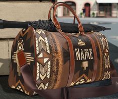 This personalized southwestern Ombre style tribal Indian travel bag is all about style. Our leather western boho duffel bag is made with high-grade waterproof fabric, it's a highly durable means of transferring your essentials wherever you go. With multiple compartments, a resilient carrying handle, and an adjustable shoulder strap, it's the perfect companion for all your adventures. This southwestern aztec tribal Indian design will have everyone asking where you got it, great Christmas or birth Brown Bohemian Travel Bag With Luggage Sleeve, Bohemian Brown Duffle Bag For Weekend Trips, Bohemian Brown Weekender Bag With Large Capacity, Bohemian Brown Weekender Bag For Weekend Trips, Bohemian Brown Weekender Bag For Overnight Trips, Brown Bohemian Weekender Bag For Overnight Trips, Indian Travel, Weekend Bags, Festival Trends