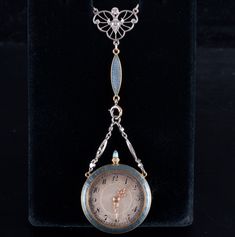 Vintage 1890's Platinum 18k Yellow Gold Diamond Enamel Watch Necklace .375ctwMetal Information: Platinum & 18k Yellow GoldTotal Weight: 31.7gPendant Dimensions: 3" x 1"Chain Width: 1.5mmChain Length: 21.5" + 3" (Watch Pendant)Circa: 1890'sAdditional Information: C.H. Meylan B RassusStone InformationMain StoneGem Type: DiamondShape: Old European (2.8mm)Color: HClarity/Quality: SI1Carat Weight: .08ctNumber of Stones: 1Accent StonesGem Type: DiamondShape: Old European (2.0mm)Color: HClarity/Quality: SI1Carat Weight: .03ctNumber of Stones: 1Accent StonesGem Type: DiamondShape: Old European (1.8mm)Color: HClarity/Quality: SI1Carat Weight: .025ctNumber of Stones: 1Accent StonesGem Type: DiamondShape: Rose (1.0mm - .80mm)Carat Weight: .01ctNumber of Stones: 24Total estimated ctw (carat total weig Watch Pendant, Watch Necklace, Gold Diamond, Platinum, Yellow Gold, Pendant, Yellow, Gold