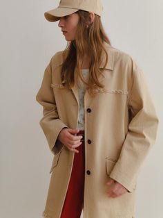 This product, referred to as the Blair Half Coat, features a casual, oversized design with frayed detailing along the edges for a contemporary touch. The coat's single-breasted front and simple collar contribute to its relaxed yet sophisticated aesthetic. It is a versatile piece that can easily transition from day to night and from casual to smart-casual settings. - The oversized fit provides a comfortable and laid-back look, suitable for various body types.- Frayed detailing along the coat's edges adds a modern, deconstructed style element.- A single-breasted front and simple collar give it a clean and versatile appearance.- The coat's design is perfect for layering over diverse outfits, making it an essential wardrobe item for effortless styling. Winter Outerwear With Frayed Hem And Relaxed Fit, Chic Cotton Outerwear With Frayed Hem, Oversized Fall Outerwear With Frayed Hem, Oversized Outerwear With Frayed Hem For Fall, Oversized Outerwear With Frayed Hem And Long Sleeves, Oversized Winter Outerwear With Frayed Hem, Oversized Outerwear With Frayed Hem For Winter, Sophisticated Aesthetic, Essential Wardrobe