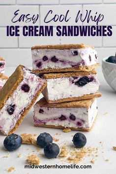 easy homemade ice cream sandwiches with blueberries and crumbs on the top are stacked up