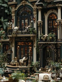 an elaborately decorated doll house with lots of furniture