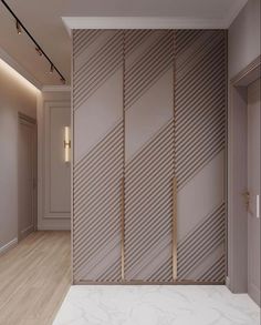 an empty room with white walls and wood flooring, along with a marble counter top