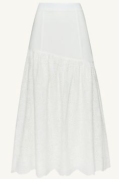 Indulge in the effortlessly chic Madelyn White Eyelet Maxi Skirt. Crafted from delicate eyelet fabric with breezy, princess seams and contrasting tiered detailing, this skirt is the epitome of luxury. Elevate any look with this exclusive piece that exudes elegance and sophistication. Model is 5'7" and is wearing size XS. Elegant Broderie Anglaise Bottoms For Spring, Chic Asymmetrical Skirt With Lace Trim, Elegant White Bottoms With Broderie Anglaise, Elegant White Broderie Anglaise Bottoms, Elegant Tiered Voluminous Skirt, Elegant Summer Skirt With Cutwork Hem, Elegant Tiered Relaxed Skirt, Chic Broderie Anglaise Skirt For Summer, Elegant Tiered Flowy Skirt