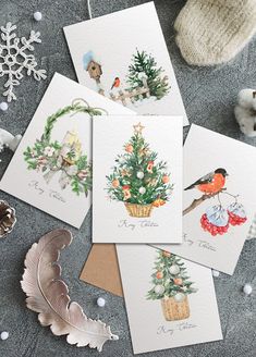 four christmas cards with pictures of birds on them