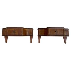 two wooden dressers sitting next to each other