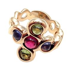 About This Piece:  Metal: 18k Yellow Gold  Measurements:  Size:4.5   Width at top: 19mm  Weight: 10.2 grams  Stones: 2 Round Amethyst stones 3.5mm 1 Round Pink Tourmaline stone 4mm 2 Round Green Tourmaline stones 3.5mm  Hallmarks: Chanel 1B2488 French Hallmarks    Please refer to the dimensions in the description above for accurate measurements. Please reach out to the seller with any questions on dimensions or fit prior to purchase. Yellow Gold Multi-stone Fusion Gemstones, Fusion Style Multi-stone Yellow Gold Gemstones, Elegant Multicolor Round Amethyst Ring, Elegant Multicolor Amethyst Ring, Fine Jewelry Multi-stone Tourmaline Gemstones, Multi-stone Tourmaline Fine Jewelry, Multi-stone Tourmaline Gemstones, Yellow Gold Tourmaline Multi-stone Jewelry, Luxury Multi-stone Tourmaline Ring