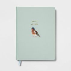 a blue notebook with a bird on it's cover and the words little birds