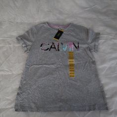 New Calvin Klein Size M Color Gray 60% Cotton 40% Modal Calvin Klein Tshirt, Cheap Calvin Klein Short Sleeve T-shirt, Classic Calvin Klein Short Sleeve T-shirt, Calvin Klein Relaxed Fit Crew Neck T-shirt, Calvin Klein Graphic Tee Short Sleeve T-shirt, Calvin Klein Graphic Print Relaxed Fit T-shirt, Womens Calvin Klein, Gray Color, Calvin Klein