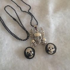 "3 skull necklace with dangling black rhinestone bling buttons 20\" chain ... Never been worn Free gift box NO Returns This necklace was a part of the inventory from my old antique shop.   Most of the jewelry was made over 10 years ago from bits and pieces found in other antique stores and estates sales. All jewelry sold \"as is\".  no returns on jewelry Check out my other Etsy Shops: https://www.etsy.com/shop/oldporchsigns https://www.etsy.com/shop/oldvintageporch Most of my signs, crafts and h Black Nickel Free Skull Necklace, Nickel Free Black Skull Necklace, Vintage Black Skull Jewelry, Black Nickel-free Skull Necklace, Halloween Necklace, Button Necklace, Bling Necklace, Skull Necklace, Black Rhinestone