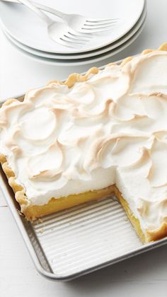 a pie sitting on top of a pan covered in frosting