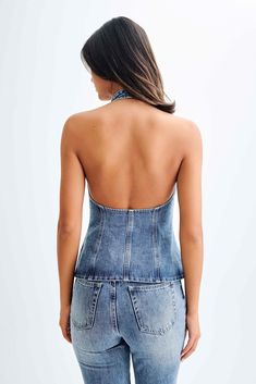 Weekend day to night.The INDIA Button Front Halter Denim Longline Top is a chic and versatile piece for any wardrobe. Featuring a halter neckline with buttons at the back and a functional centre-front button closure, this top combines style and convenience. Its longline design includes a split at the hem and a low back for added flair. Perfectly paired with the Janine High Waisted Straight Leg Jeans, this outfit creates a modern and effortlessly stylish look. Chic Light Wash Top With Button Closure, Fitted Washed Blue Tops With Button Closure, Chic Washed Blue Denim Top With Button Closure, Chic Denim Blue Tops For Night Out, Chic Fitted Dark Wash Tops, Chic Dark Wash Fitted Tops, Summer Dark Wash Tops With Button Closure, Chic Sleeveless Dark Wash Tops, Dark Wash Button Closure Top For Summer