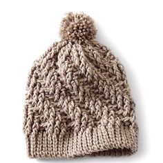 a knitted beanie hat with a pom - pom on the top