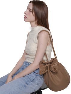 Editor's NotesTUO presents an Owen bucket bag with a drawstring detail. It is a stylish bag that adds a chic and fashionable vibe. - Bucket bag style- Good storage capacity- Drawstring closure- Feminine and chic mood Measurements(in.)One Size- Size: 8.86 in. (W) * 12.60 in. (H) * 9.06 in. (D)- Strap: 0.39 in. (W) * 35.04 in. (L) Composition & Care- Material: Artificial Leather- Natural leather may have fine scratches and wrinkles- Bright leather can get stained by denim or dar Chic Beige Pouch Bucket Bag, Chic Beige Bucket Bag For Day Out, Brown Bucket Shoulder Bag For Day Out, Brown Shoulder Bucket Bag For Day Out, Trendy Brown Bucket Bag For Day Out, Trendy Bucket Bag With Removable Pouch For Day Out, Beige Bucket Bag With Removable Pouch For Day Out, Chic Crossbody Bucket Bag For Day Out, Trendy Drawstring Travel Bag