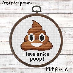 a cross stitch pattern with the words have a nice poop on it and an emotic