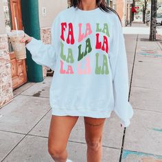 Fa La La your way all through this Christmas Season in our festive Holiday sweatshirt. Our adorable and cozy Fa la la la sweatshirt will have you in the Christmas spirit in no time! Grab your hot cocoa and enjoy the holiday season in our fun and cheerful Christmas sweatshirts. Fa La La Sweatshirt, Christmas Shirt, Cute Christmas Shirt, Christmas sweatshirt, Holiday shirt, Christmas Shirt for Women, gifts, Ideal for any situation, a unisex heavy blend crewneck sweatshirt is pure comfort. These ga Casual Cotton Christmas Sweatshirt, Casual Christmas Cotton Sweatshirt, Fun White Sweatshirt For Winter, Casual Christmas Sweater With Relaxed Fit, Winter Fun Relaxed Fit Tops, Fun Crew Neck Winter Tops, Fun Crew Neck Tops For Winter, Fun Winter Tops With Relaxed Fit, Casual White Holiday Sweatshirt