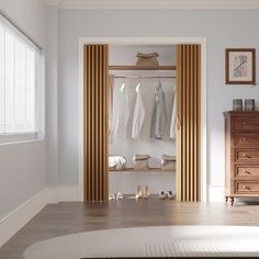 an open closet with clothes and shoes on the shelves next to a chest of drawers