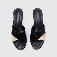 Slide into comfort in these sophisticated sandals set on a stacked heel with a spacious squared-off toe. Color: Black Material: PU Heel Height: 2.36'' Sole Material: Non-slip Rubber Sole Summer Slip-on Heels With Block Heel, Black Slip-on Wedge Sandals For Spring, Black Mules With Wooden Low Heel, Black Square Toe Mules With Contrasting Heel, Black Low Heel Sandals For Summer, Summer Slip-on Mules With Wooden Heel, Black Open Toe Block Heels For Summer, Black Sandals With Wooden Low Heel, Chic Black Wedge Sandals With Textured Footbed