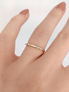 Beautiful Baguette Diamond Wedding Band/Stacking Ring. A bar setting makes this ring unique and modern. Available in any color 14K Gold. Great accent for stacking, for special occasions, or wedding bands! Available in sizes 4.5-10! Approx Gold Weight: 1.25g 14k Gold Approx Diamond Weight: 0.23cts 6 Diamonds, SI clarity & GH color *Shop Policies:* SHIPPING: All purchases are processed within 1-2 business days. Items that are made to order will be shipped within the projected date shared with Minimalist Channel Set Diamond Wedding Ring, Rose Gold Baguette Diamond Jewelry For Anniversary, Gold Baguette Ring For Anniversary, Rose Gold Jewelry With Baguette Diamonds For Anniversary, Anniversary Rose Gold Jewelry With Baguette Diamonds, Gold Half Eternity Baguette Ring, Gold Baguette Ring With Half Eternity Detail, Gold Baguette Ring With Half Eternity Design, Gold Baguette Ring With Half Eternity