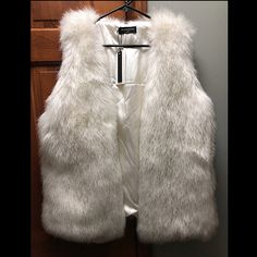 New With Tags! Purchased From Urban Outfitters. Faux Fur With Hook And Eye Front Closure. Very Fluffy And Very Cute. Pink Gucci Purse, White Fur Vest, Faux Shearling Vest, Gucci Purse, Motorcycle Vest, Shearling Vest, White Faux Fur, White Fur, Black Vest