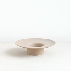 a white bowl sitting on top of a table