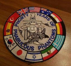 a patch with the words forty years of fabulous pantoms written in different languages