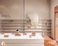 the inside of an eye contact store with wooden boxes on display and shelves full of jewelry