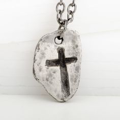 This Medieval Cross Gothic Guitar Pick Pendant is the perfect jewelry piece for any fun-loving rocker. Expertly crafted from 925 sterling silver, it will have you looking, and feeling, like a true Medieval lord! With its dark patina for a vintage look, this piece gives off an old-school vintage vibe - perfect for reminding you to rock on! Hand Forged Silver Medieval Jewelry, Hand Forged Medieval Silver Jewelry, Sterling Silver Necklace With Oxidized Cross Pendant, Medieval Sterling Silver Necklace In Silver, Medieval Style Silver Jewelry Gift, Medieval Handmade Sterling Silver Jewelry, Handmade Medieval Sterling Silver Jewelry, Hand Forged Stainless Steel Jewelry For Gifts, Hand Forged Stainless Steel Jewelry As Gift