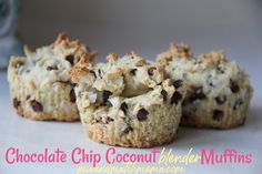 three chocolate chip coconut flake muffins on a white surface