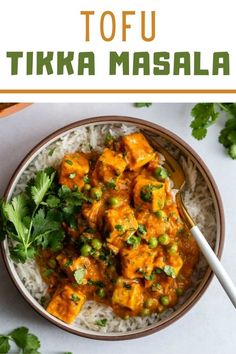 tofu tikka masala in a bowl with rice and cilantro on the side