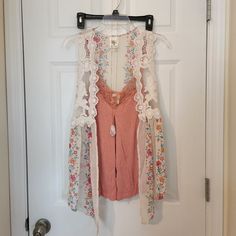 Size Small Rose Colored Cami W/Lace Beige Cover Up With Flowers And Lace Gold Colored Necklace With Rose Colored Pendant Has Been Washed, But Never Worn Make An Offer White Spring Vest For Vacation, White Bohemian Tank Top With Floral Print, Bohemian Lace Tank Top For Spring, Sleeveless Lace Trim Vest For Spring, White Spring Festival Vest, Casual Summer Vest With Lace Trim, Bohemian Sleeveless Vest For Day Out, White Vest For Spring Festival, Spring Vacation Lace Tank Top