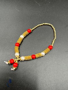 Gold and red beads chain for small idols or god pictures Red Round Beaded Bracelets For Festivals, Red Beads For Festivals Gift, Red Beads For Festivals And Gifts, Traditional Gold Beaded Chain Bracelets, Red Beads For Festival Gifts, Spiritual Red Beads For Festive Occasions, Red Beaded Bracelets With Beaded Chain, Red Beaded Necklaces For Celebration, Red Spiritual Beads For Festive Occasions