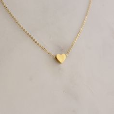 Dainty Heart Pendent Necklace  - This listing is for pair os the Dainty Heart Pendent Necklace. Perfect for everyday and layering - Length: 16" + 2" extender  - Base Material: High Quality Stainless Steel - Finish: 18K Gold - Measurements: Heart - 7mm/7mm  - Nickel Free and Tarnish Free - All our jewelry is packaged in gift ready boxes. If you would like multiple items from your order packaged separately please let us know! © 2024 Generation of Daughters Gold Heart Necklace With Heart Print For Valentine's Day, Heart Shaped Charm Necklace As Gift, Minimalist Heart Charm Necklace With Heart Beads, Heart Shaped Clavicle Chain Charm Necklace As Gift, Minimalist Heart Beads Charm Necklace, Gold Heart Pendant Necklace With Heart Print, Heart-shaped Jewelry With Heart Print For Valentine's Day, Gold Heart Necklace With Heart Pendant, Dainty Heart Print Necklace For Valentine's Day