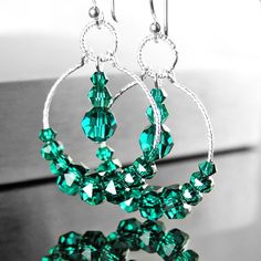 Dainty, emerald green hoop earrings featuring RARE Swarovski crystals beaded onto sparking Sterling silver hoops and suspended from Sterling silver ear-wires.  Nice gift idea for May birthday Lady :)  More details: - ALL .925 Sterling silver - handcrafted hook ear-wires, textured 20mm hoops and links  - Brilliant, faceted Swarovski crystal (3-6mm)  - The earrings are approx. 1 3/4" (43 mm) in total length Here, you can view more EMERALD GREEN jewelry, in my shop: https://www.etsy.com/shop/DorotaJewelry?ref=hdr_shop_menu&search_query=emerald Here, you can view HOOP EARRINGS, in my shop: https://www.etsy.com/shop/DorotaJewelry?ref=hdr_shop_menu&search_query=hoop+earrings --- Please, keep in mind that the jewelry in the photographs looks larger than it does in person. I post close up pictures Green Hoop Earrings, Birthday Lady, Emerald Green Jewelry, Emerald Green Crystal, Emerald Crystal, Earring Making, Crystal Hoop Earrings, Business Products, Green Jewelry