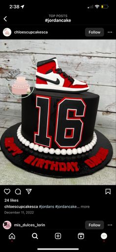 a black and red birthday cake with the number sixteen on it's top layer