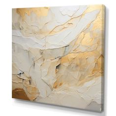 an abstract painting with gold and white colors on the canvas, it looks like something out of