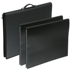 two black binders sitting next to each other