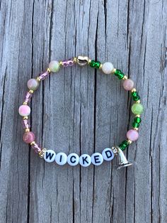 a bracelet with words and beads on it that says,'i woked '