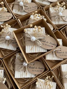 wedding favors are arranged in boxes on display