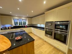 a kitchen with an island and two ovens